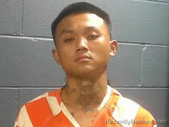 Mugshot of Shi Sho booked in McDonald County, Missouri on July 27, 2026