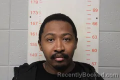 Mugshot of John Mburu Karora booked in Polk County, Missouri on October 12, 2026