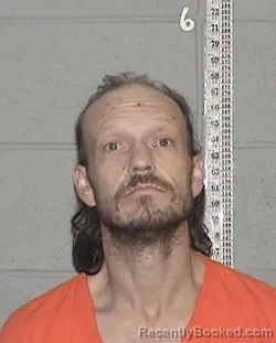 Mugshot of BOONE CAUDILL KRATZER booked in Flathead County, Montana on March 9, 2026