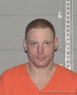 Mugshot of BRANDON JAMES LEWIS booked in Flathead County, Montana on March 22, 2026