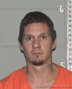 Mugshot of JUSTIN ANDREW WALKER booked in Flathead County, Montana on July 8, 2026