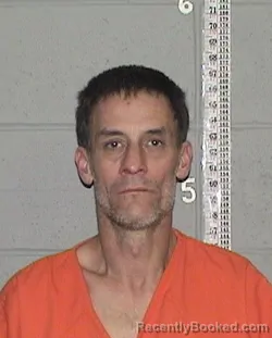 Mugshot of ZACHARY EUGENE RHODES booked in Flathead County, Montana on March 10, 2026