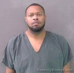 Mugshot of REGINALD CAVELL MOORE
