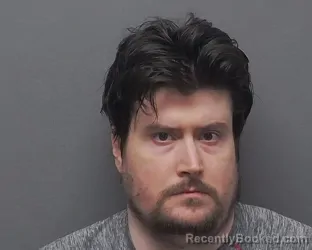 Mugshot of MICHAEL E MELCHERT