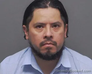 Mugshot of JOSE G MANRIQUEZ