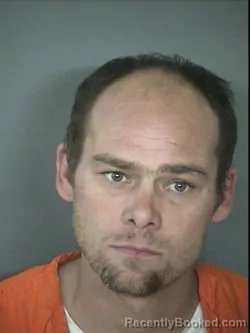 Mugshot of TRAVIS J CHAMPNEY