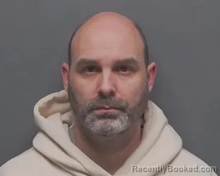 Mugshot of JUSTIN J BUDD