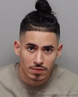 Mugshot of CARLOS A OLAGUE booked in Bexar County, Texas on March 14, 2026