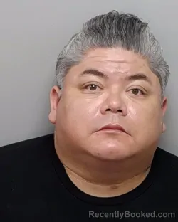 Mugshot of ROLAND E JR CISNEROS booked in Bexar County, Texas on March 14, 2026