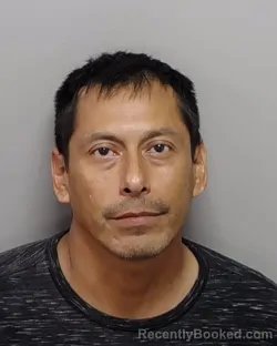 Mugshot of Juan Munoz Bustos booked in Bexar County, Texas on July 13, 2026