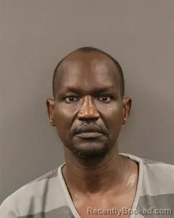 Mugshot of Moses A Oluak booked in Hall County, Nebraska on June 7, 2026
