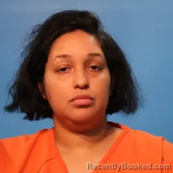 Mugshot of Alyssa Nichole Spikes booked in Brazoria County, Texas on April 22, 2026