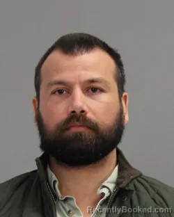 Mugshot of JOHN KIRAN GUSTAFSON