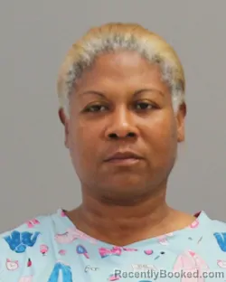 Mugshot of CHENIQUA LAVERNE JOHNSON booked in Brazos County, Texas on April 26, 2026