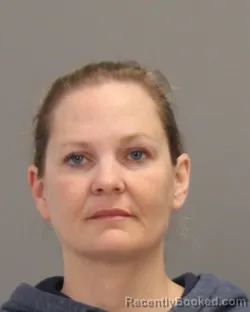Mugshot of KIMBERLY DAWN PERKINS booked in Brazos County, Texas on May 13, 2026