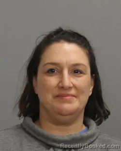 Mugshot of CHRISTINA JEANETTE AZZARELLO booked in Brazos County, Texas on June 26, 2026