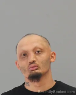 Mugshot of JOHNNY MICHAEL ACIERTO MARTINEZ booked in Brazos County, Texas on July 6, 2026