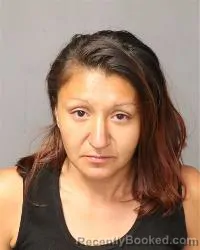 Mugshot of Cinthia Jasmin Alire booked in Bernalillo County, New Mexico on March 12, 2026