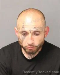 Mugshot of Johnny Derick Bencomo booked in Bernalillo County, New Mexico on June 27, 2026