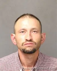 Mugshot of Nathan Thomas Burks booked in Bernalillo County, New Mexico on August 9, 2026