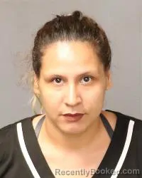 Mugshot of Leslie Padilla booked in Bernalillo County, New Mexico on August 23, 2026