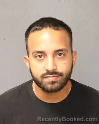 Mugshot of Abraham Bustillos booked in Bernalillo County, New Mexico on August 24, 2026
