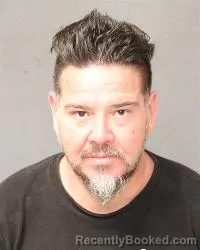 Mugshot of John Carlos Delgado booked in Bernalillo County, New Mexico on October 15, 2026