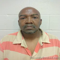 Mugshot of OMORO LEMIN GUMS booked in Brown County, Texas on April 21, 2026