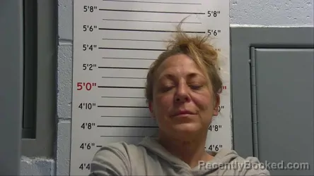 Mugshot of JUSTINE AGNES PUCCIO booked in Sandoval County, New Mexico on April 12, 2026