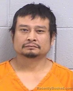 Mugshot of Alzano Alex Jones booked in San Juan County, New Mexico on April 21, 2026