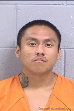 Mugshot of Travis Fermin Lee booked in San Juan County, New Mexico on August 14, 2026