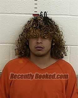 Booking photo from San Miguel County, New Mexico