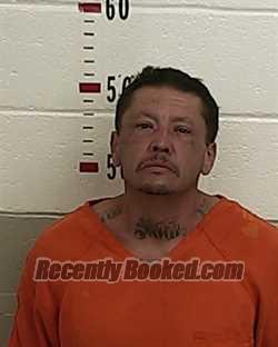 Booking photo from San Miguel County, New Mexico