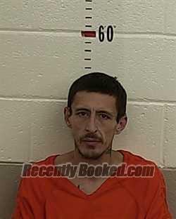 Booking photo from San Miguel County, New Mexico