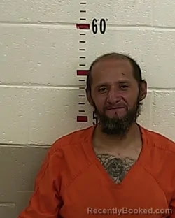 Mugshot of MICHAEL URIOSTE booked in San Miguel County, New Mexico on April 8, 2026