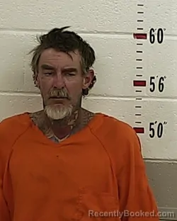 Mugshot of GEOFFREY CRUM booked in San Miguel County, New Mexico on May 13, 2026