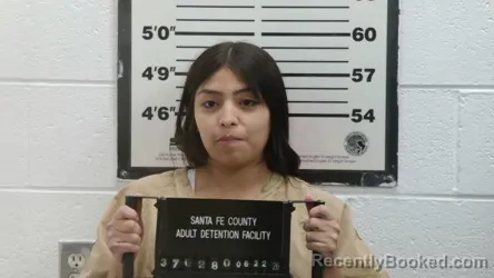 Mugshot of BEATRIZ GENEVIEVE ANAIE AREVALO booked in Santa Fe County, New Mexico on May 22, 2026