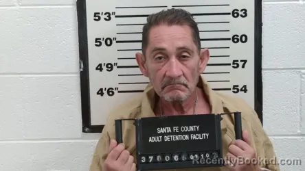 Mugshot of JOHN GILBERT MARTINEZ booked in Santa Fe County, New Mexico on July 10, 2026