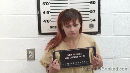 Mugshot of Yasmine Anail Carrera booked in Santa Fe County, New Mexico on August 22, 2026