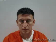 Mugshot of Herbert Cesar Julio booked in Cameron County, Texas on April 20, 2026
