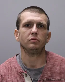 Mugshot of JUSTIN WILLIAM ROBINSON