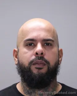 Mugshot of Carlos Javier Marquez booked in Ontario County, New York on August 19, 2026