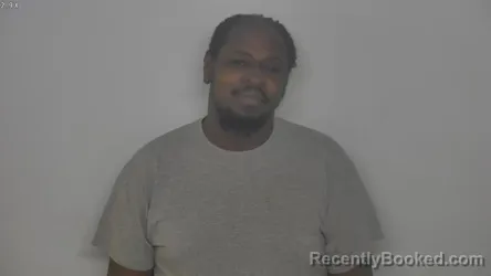 Mugshot of JOHN COAXUM