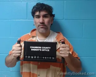 Mugshot of Dennis Carlos Munoz booked in Chambers County, Texas on May 13, 2026