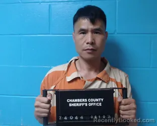 Mugshot of Qinfei He booked in Chambers County, Texas on June 10, 2026
