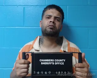 Mugshot of Carlos Omar Rosario Roman booked in Chambers County, Texas on June 30, 2026