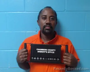 Mugshot of Wilfred Raphael Mwingira booked in Chambers County, Texas on September 15, 2026