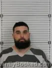 Mugshot of CHRISTIAN MICHAEL COLLINS booked in Williams County, North Dakota on June 25, 2026