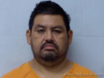 Mugshot of JOSE ANACLETO FLORES-CARRILLO booked in Beckham County, Oklahoma on July 23, 2026