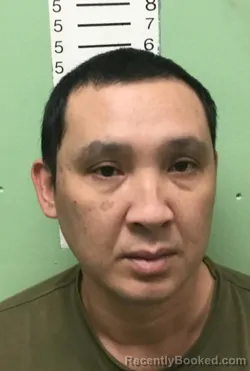 Mugshot of NGOC HUU MAI booked in Bryan County, Oklahoma on March 13, 2026